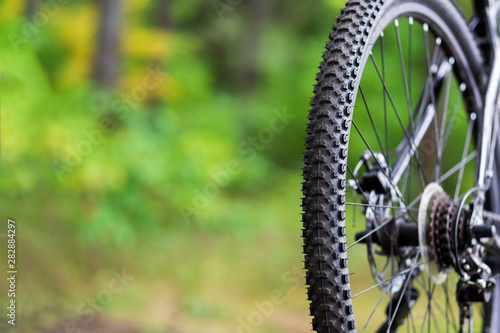 Close-up of Bicycle mud tire . Rear wheel of mountain bike