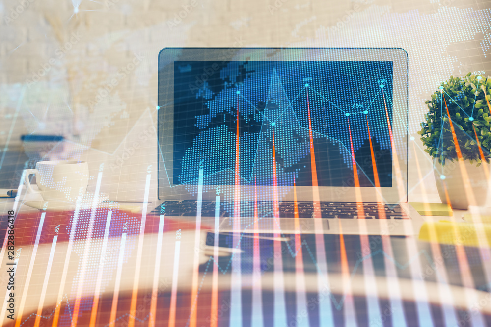 Forex market graph hologram and personal computer on background. Double exposure. Concept of investment.