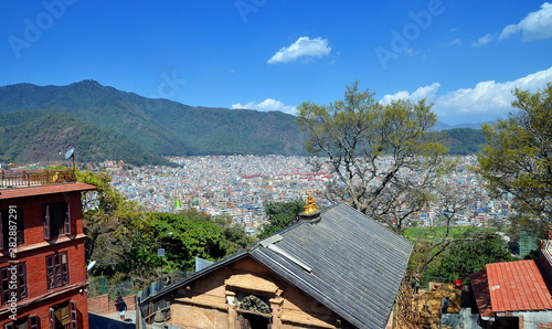 Magnigicient panoramic roof top view on sunny Kathmandu, capital of Nepal photo