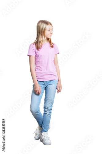 Full length portrait of cute girl in casual clothing posing isolated