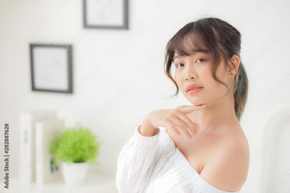 Portrait of beautiful young asian woman makeup of cosmetic, girl happy and smile attractive, face of beauty perfect with wellness in the bedroom at home with skin care and healthcare concept. Portrait of beautiful young asian woman makeup of cosmetic, girl happy and smile attractive, face of beauty perfect with wellness in the bedroom at home with skin care and healthcare concept.