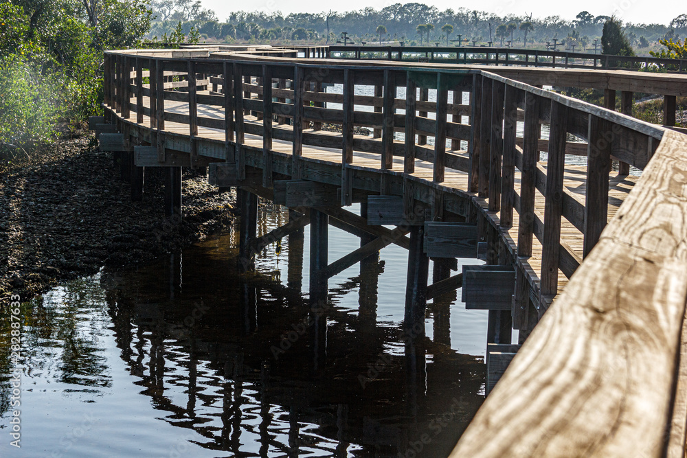 Boardwalk crosses waterway in the preserve