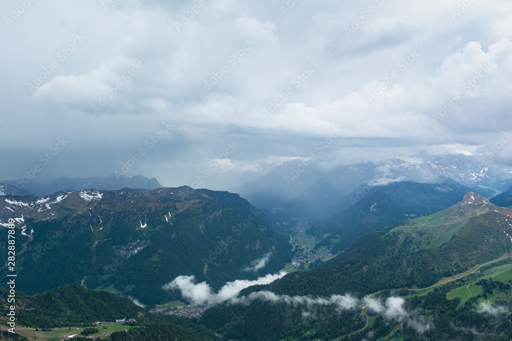 Rain shaft and thunderstorm over Fassa Valley (Val di Fassa). Do