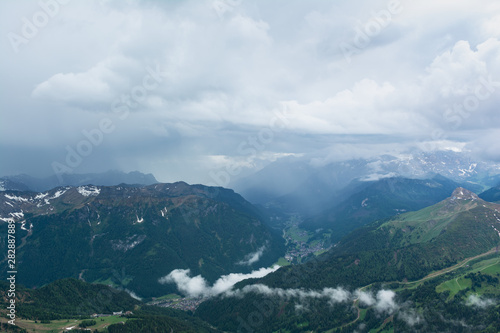 Rain shaft and thunderstorm over Fassa Valley (Val di Fassa). Do
