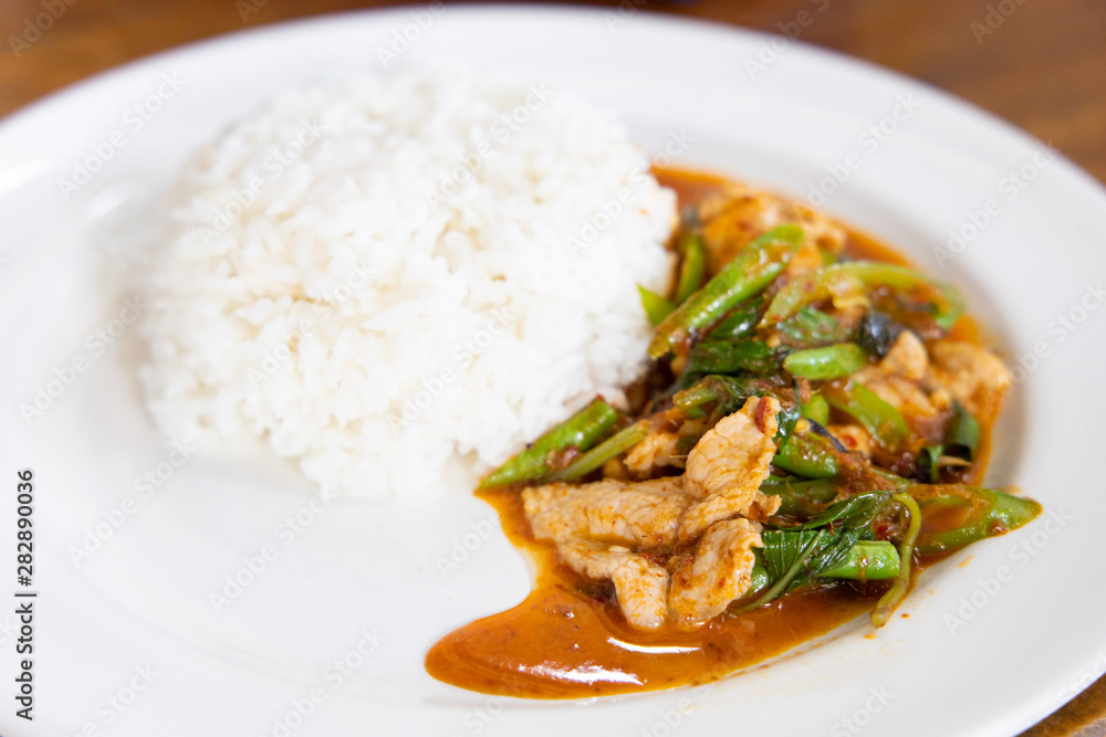 Stir Fried Pork with Red Curry Paste and Sweet Basil. Stir Fried Pork with Red Curry Paste and Sweet Basil.