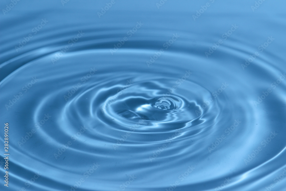 Texture, background with falling water drops and waves with blue water Texture, background with falling water drops and waves with blue water