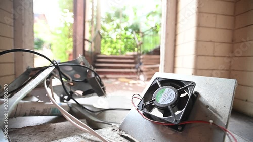Old Spinning Fan WIth Old Abandoned Building