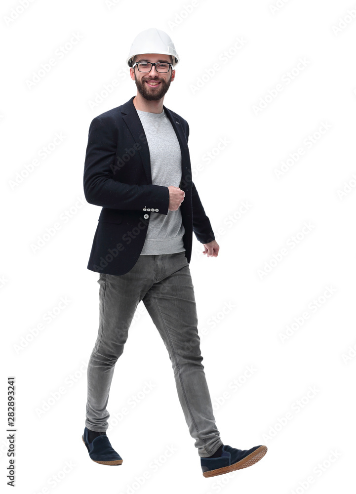 in full growth. male architect confidently stepping forward in full growth. male architect confidently stepping forward