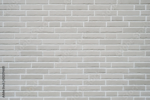 gray clinker brick wall background - modern building exterior with brick slip cladding photo