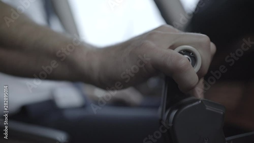 Pilot push thrust lever handle for takeoff a plane in the cockpit and push back the lever - ungraded color
