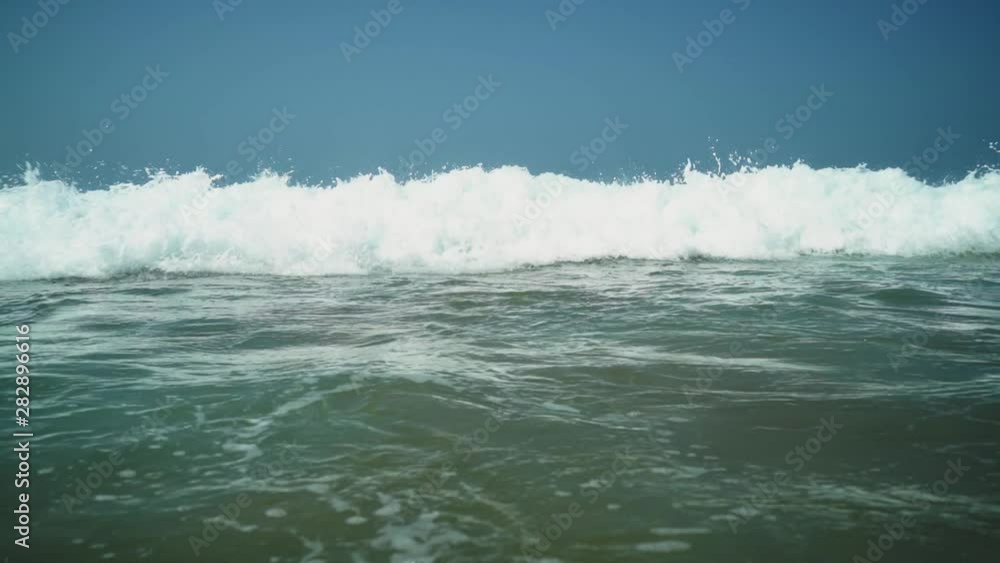 Close up of waves rolling to the beach Close up of waves rolling to the beach