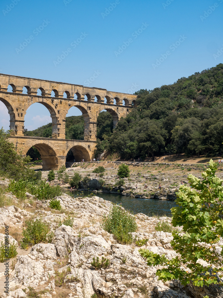 Fototapeta premium France, July 2019: The beautiful nature of southern France with its famous landmark roman bridge Pont du Gard, located near Avignon