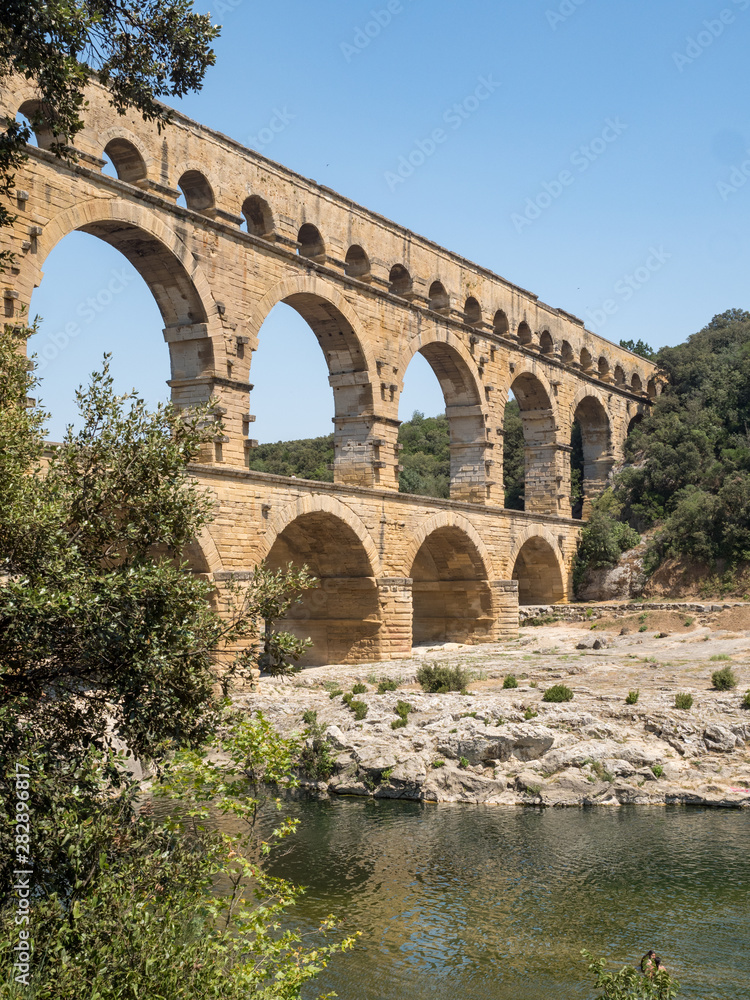 France, July 2019: The beautiful nature of southern France with its famous landmark roman bridge Pont du Gard, located near Avignon