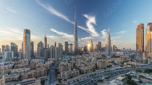 Dubai Downtown skyline day to night timelapse with Burj Khalifa and other towers paniramic view from the top in Dubai