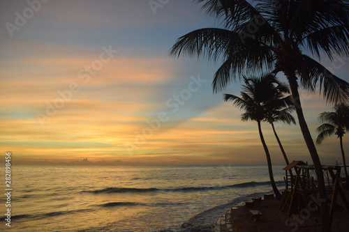 Fototapeta Naklejka Na Ścianę i Meble -  Maceio - Alagoas - Brasil - March 22 2019 - beautiful sunset and coconut trees