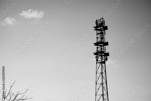 Black and white landscape picture of a telecomunication antenas