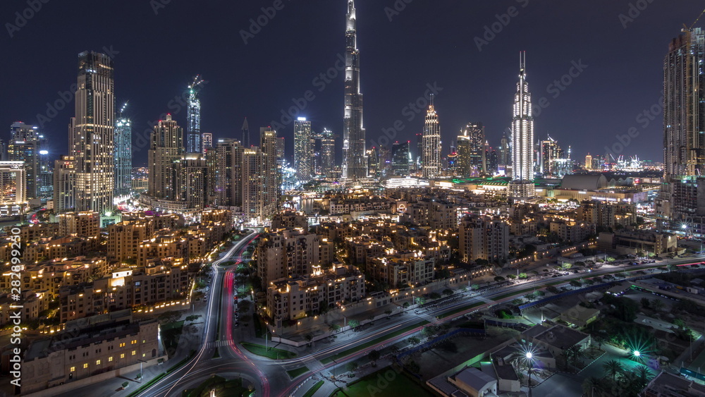 Dubai Downtown skyline night timelapse with Burj Khalifa and other towers paniramic view from the top in Dubai