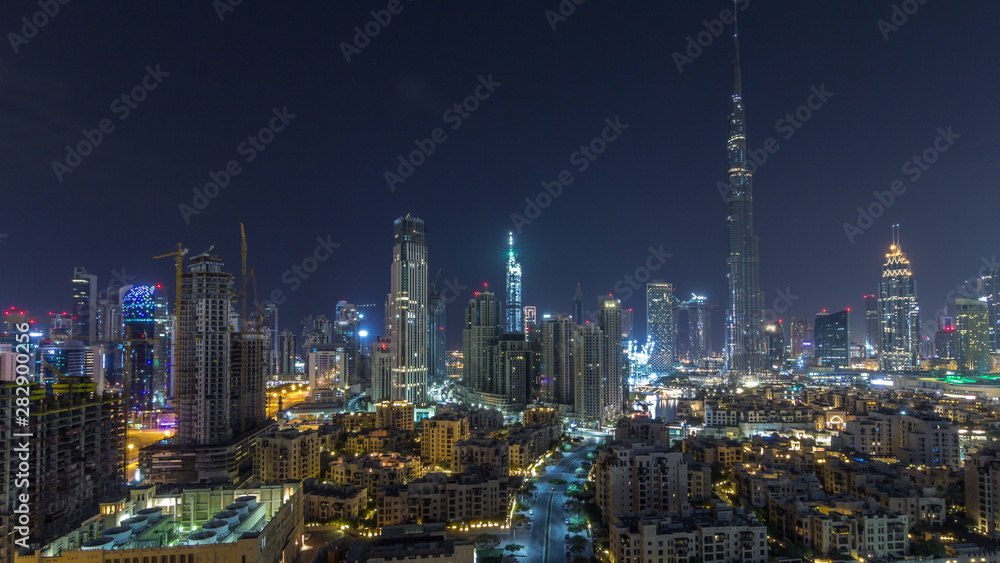 Dubai Downtown skyline during all night timelapse with Burj Khalifa and other towers paniramic view from the top in Dubai