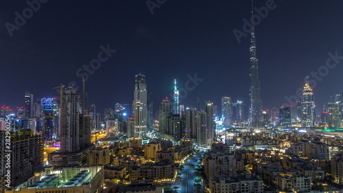 Dubai Downtown skyline during all night timelapse with Burj Khalifa and other towers paniramic view from the top in Dubai