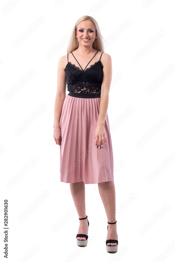 Candid photo of young stylish pretty blonde woman in summer fashion smiling. Full body isolated on white background. Candid photo of young stylish pretty blonde woman in summer fashion smiling. Full body isolated on white background.