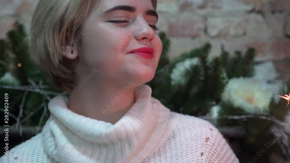 Charming Girl With Sparkler Celebrating Christmas. Charming Girl With Sparkler Celebrating Christmas.