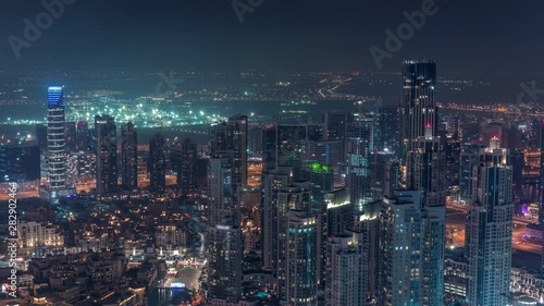 Wallpaper Mural Amazing aerial view of Dubai downtown skyscrapers night timelapse with fountains, Dubai, United Arab Emirates. Illuminated modern towers and construction site Torontodigital.ca