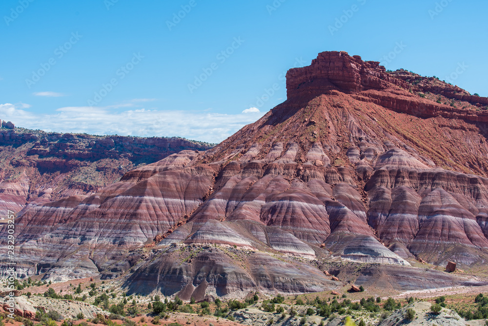 Landscape of purple, red, pink and white striped or banded hills at Paria Canyon in Grand Staircase Escalante National Monument