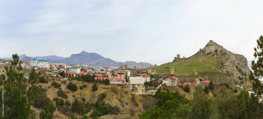 Panoramic view of the old Genoese fortress in the resort town of Sudak in the Crimea. Cloudy day