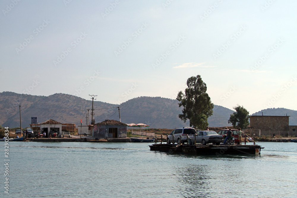 Cars, a motorbike and foot passengers on a cable ferry near Butrint, Albania on Monday 2 September 2013 Cars, a motorbike and foot passengers on a cable ferry near Butrint, Albania on Monday 2 September 2013