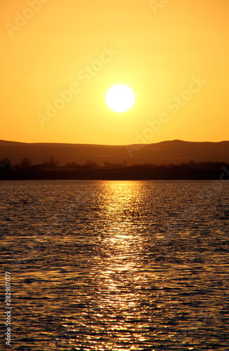 Sunset over the Birket Siwa salt-water lake  in the Siwa oasis  Egypt on Sunday 14 November 2010