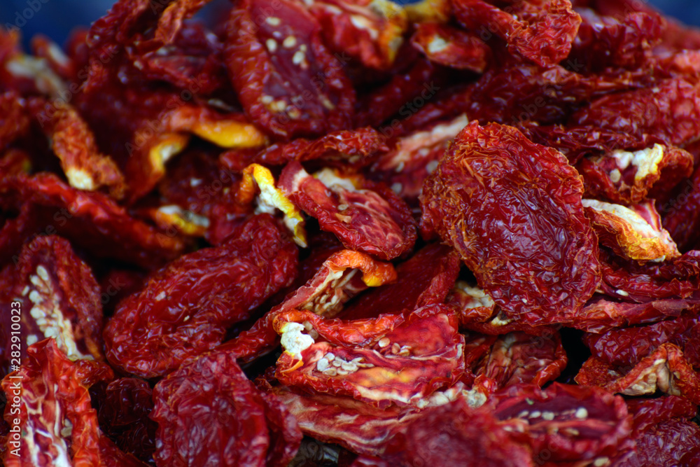 dried tomatoes in an oriental bazaar on a counter dried tomatoes in an oriental bazaar on a counter