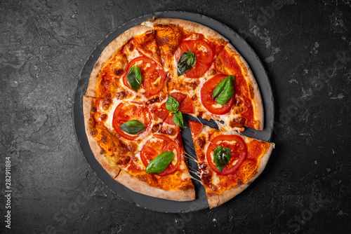 salami pizza. pepperoni pizza on black background