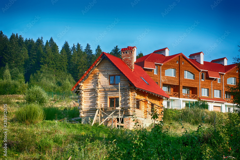 The construction of a beautiful house in the forest. The construction of a beautiful house in the forest.