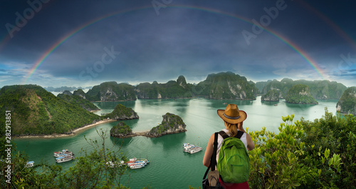 Young tourist girl watching the Halong Bay, travel and vacation concept ( Vietnam ) 