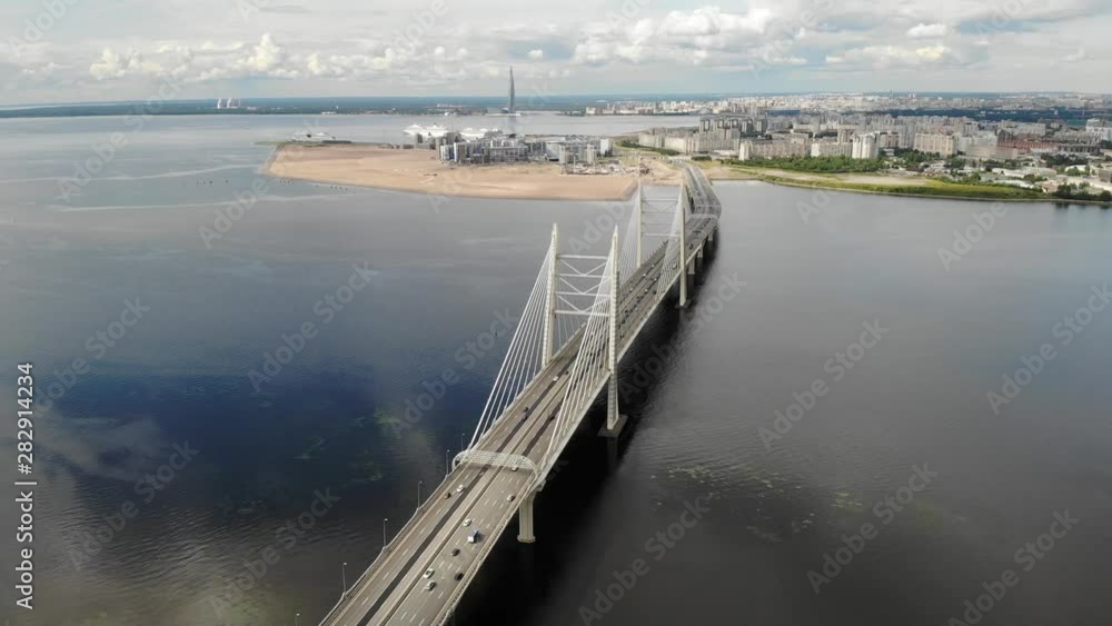 Highway bridge in the sea. Sandy beach. Saint-Petersburg. Metal constructions Highway bridge in the sea. Sandy beach. Saint-Petersburg. Metal constructions