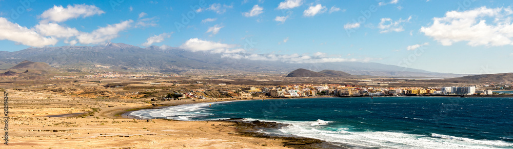 A panoramic view of Playa Leocadio Machado beach and El Medano town from Mount Roja nature reserve, Tenerife, Spain