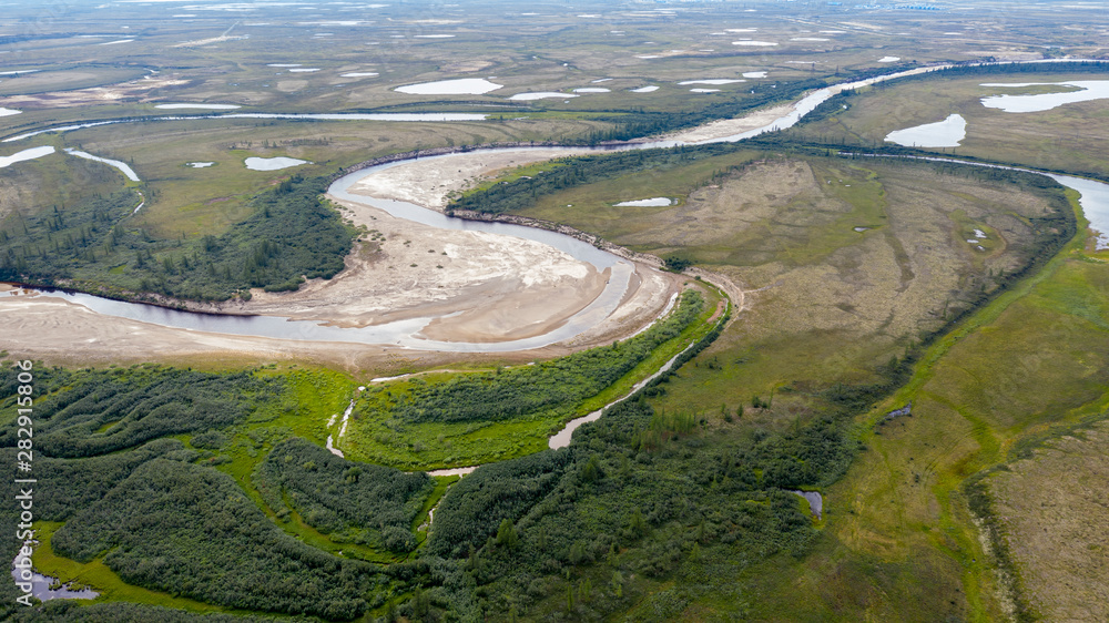 Landscape of the forest-tundra and the sandy river bank, photo from quadrocopter, bird's eye view.Arctic Circle, tunda