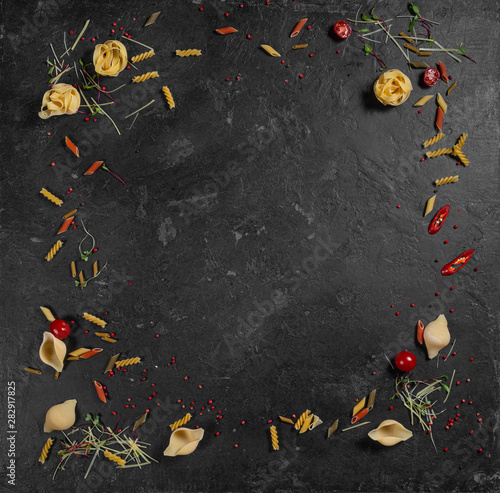 Food background. Fresh farmer vegetables at dark beton table. Space for text.