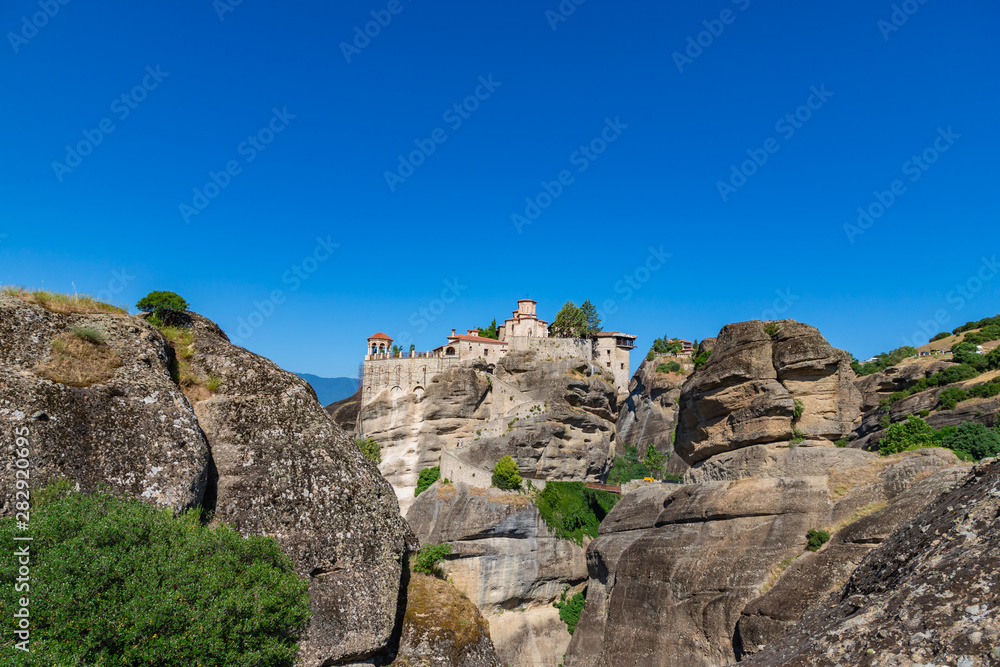 View of rock with Monastery of Varlaam and Great Meteoron in Meteora, Greece