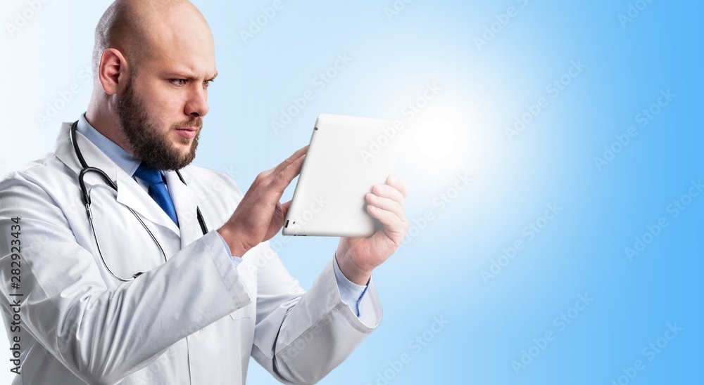 Close-up Doctor at hospital working with tablet pc Close-up Doctor at hospital working with tablet pc