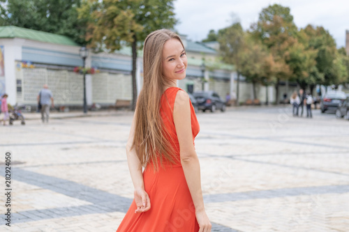 Attractive, Slim, Beautiful Girl Wearing White Shirt And Maxi Long Red Silk Fabric Skirt Fly And Wave In The Wind Walking. Fashion Concept