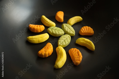 Fruit candy on black. Delicious fruit candy. Multicolored fruit candy.