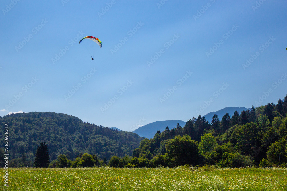 Paragliding in near lake Bohinj, Julian Alps, Slovenia Paragliding in near lake Bohinj, Julian Alps, Slovenia
