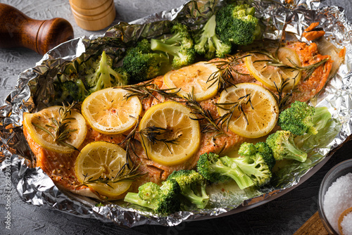 grilled whole salmon fillet with lemon and rosemarry