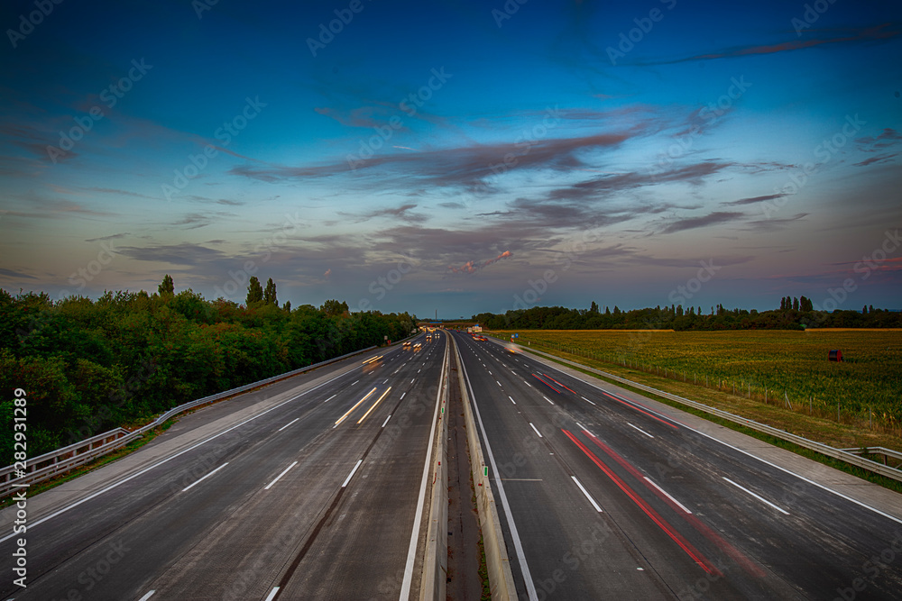 busy highway traffic during the summer night