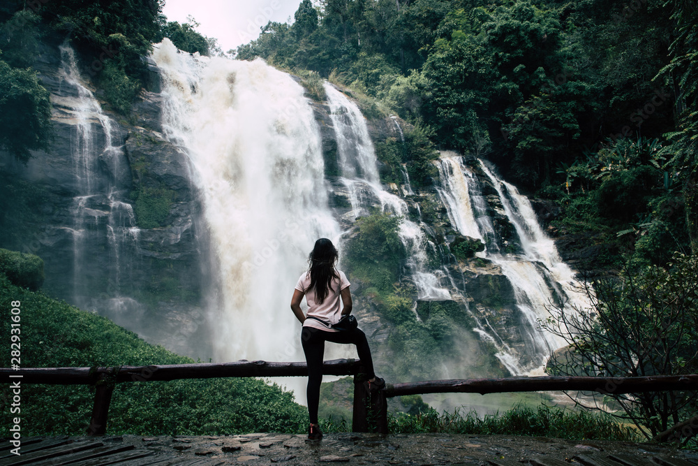 Beautiful woman at big waterfall after hiking in Chiang Mai (Thailand) Beautiful woman at big waterfall after hiking in Chiang Mai (Thailand)