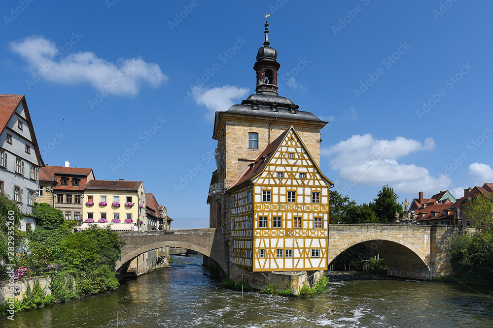 Bamberg, Germany - July 14, 2019; Center of Bamberg a popular tourist destination with ancient center with bridges, flowers and timbered houses