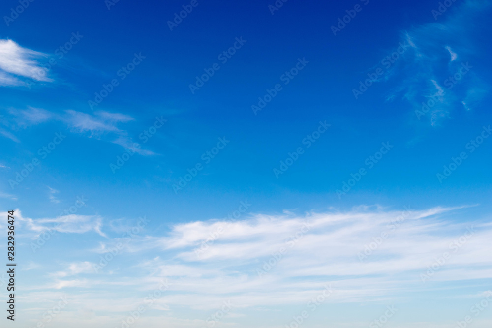 The sky is blue, the white clouds float in a beautiful view, the sun shines down on the clouds. The sky is blue, the white clouds float in a beautiful view, the sun shines down on the clouds.