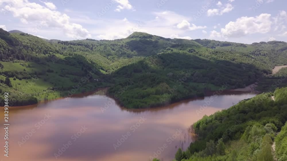 Static aerial view with right to left pan of the Apuseni Mountains, Geamana, and the natural disaster of pollution and poisons at Rosia Montana Static aerial view with right to left pan of the Apuseni Mountains, Geamana, and the natural disaster of pollution and poisons at Rosia Montana