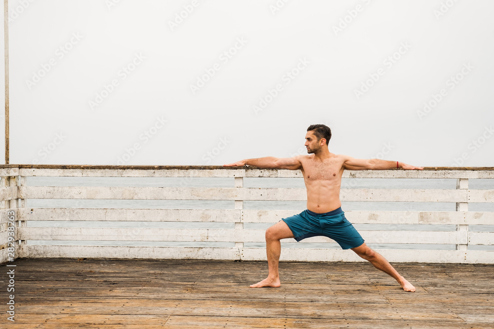 young man doing yoga